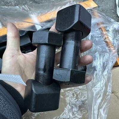 Screws, chains, drive teeth, and screws for the tracks of excavators and bulldozers